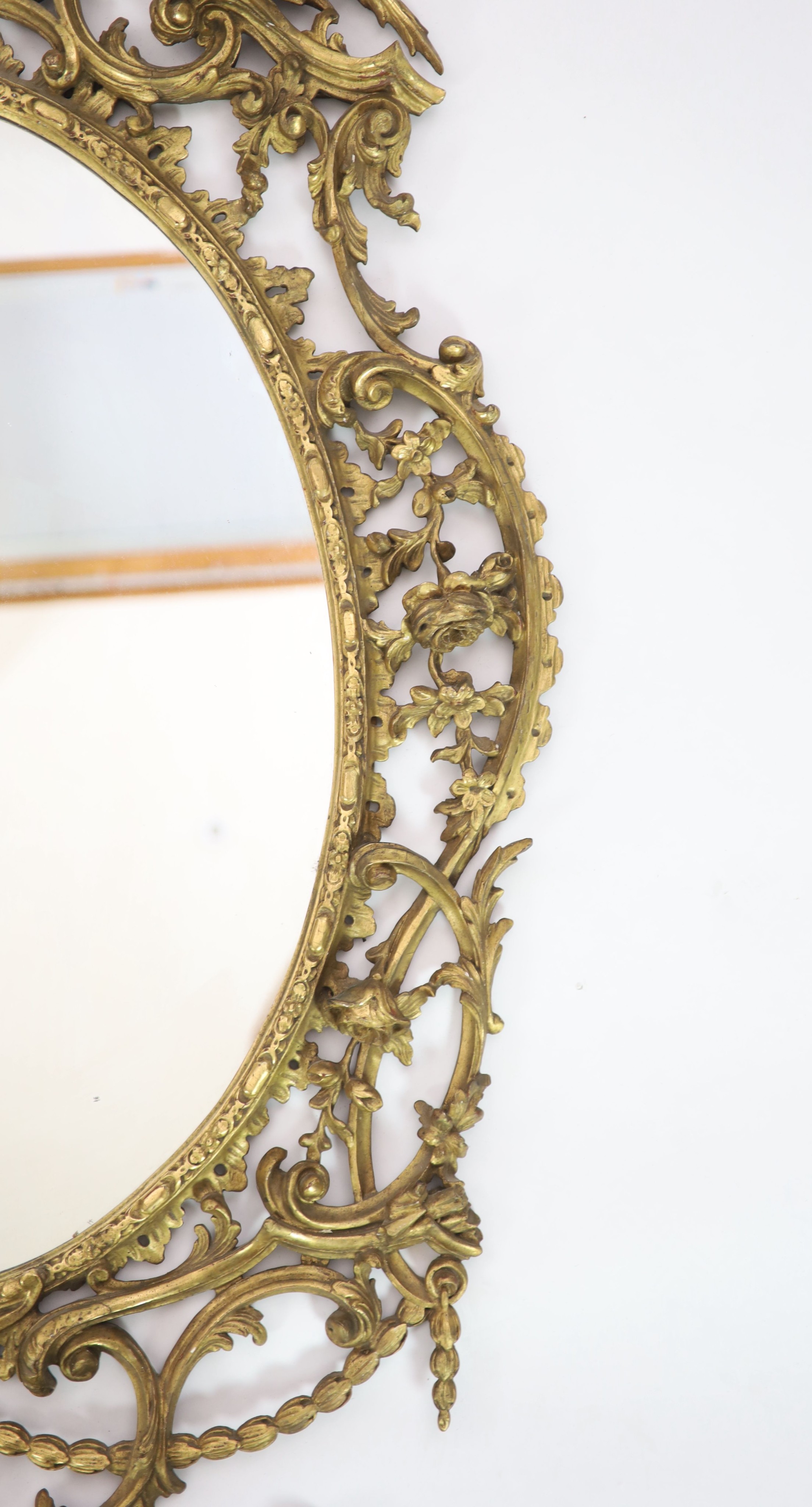 A 19th century Chippendale style gilt and gesso wall mirror W 104cm H 157cm